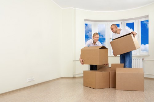 Unpacking service team arranging furniture in a new home